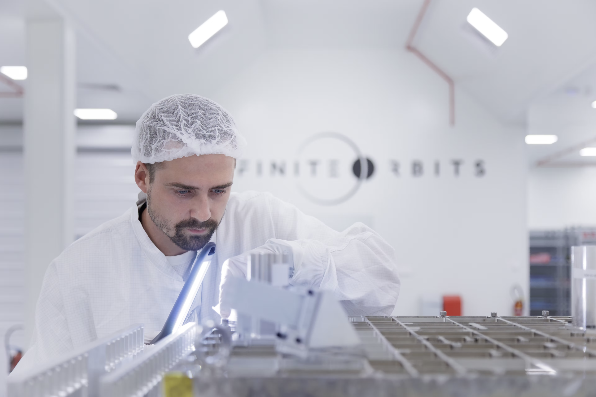 Infinite Orbits engineer integrating spacecraft systems